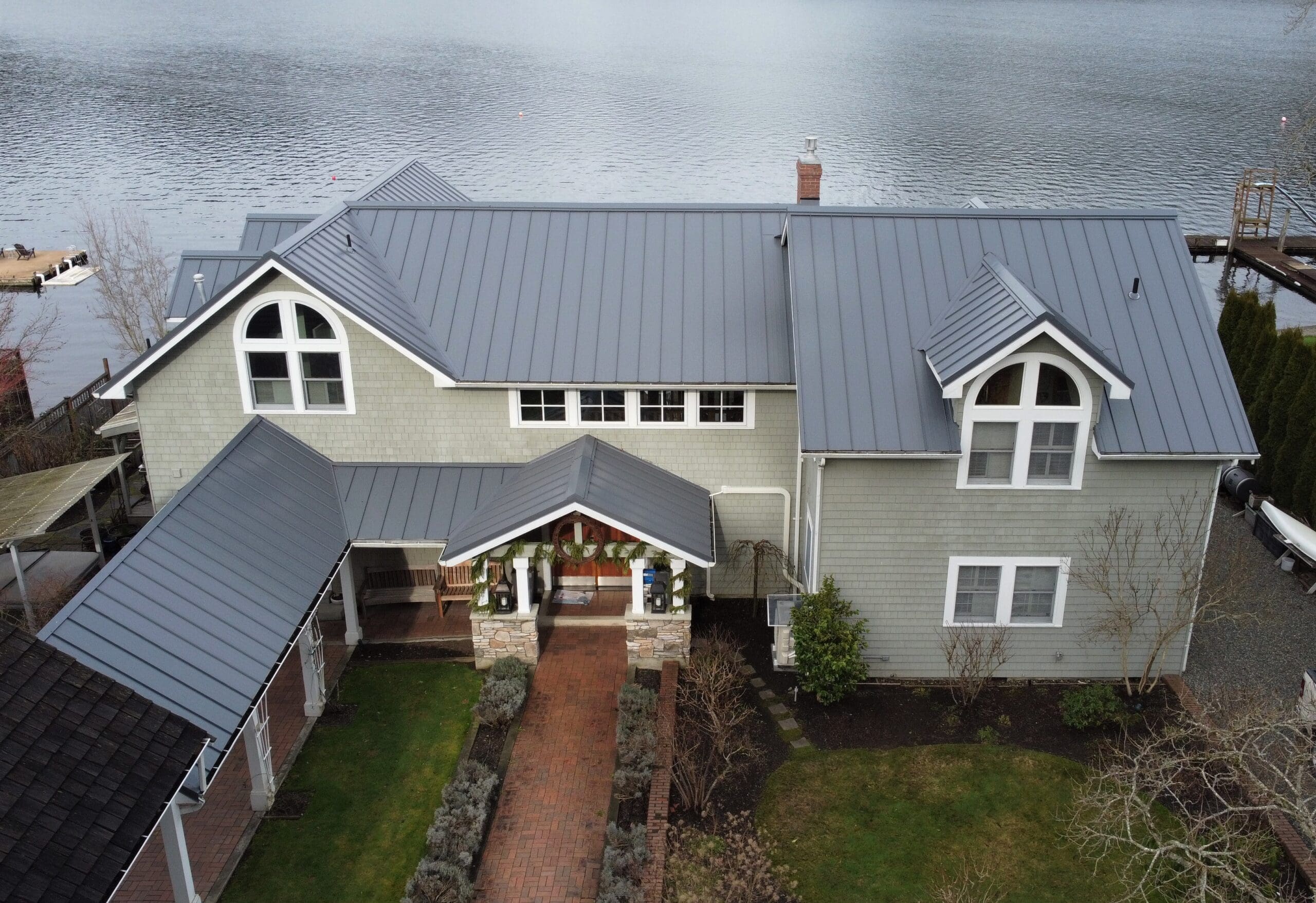Modern home with a standing seam metal roof installed by Skyline Roofing